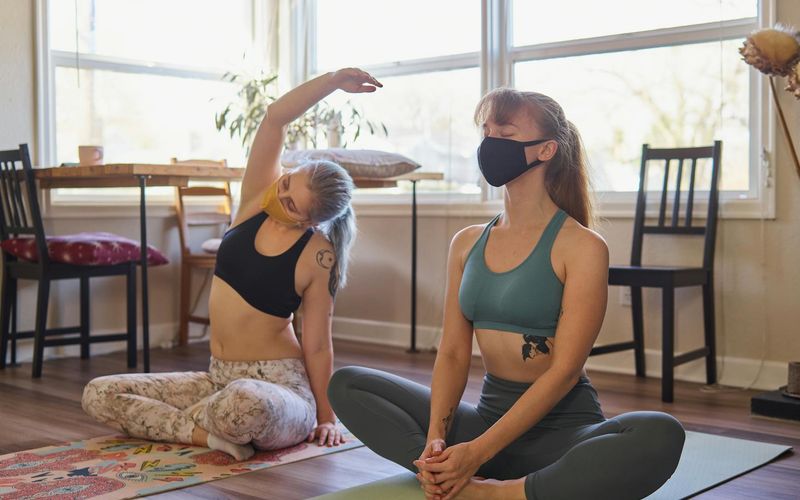 A calm and spacious room with a yoga mat.